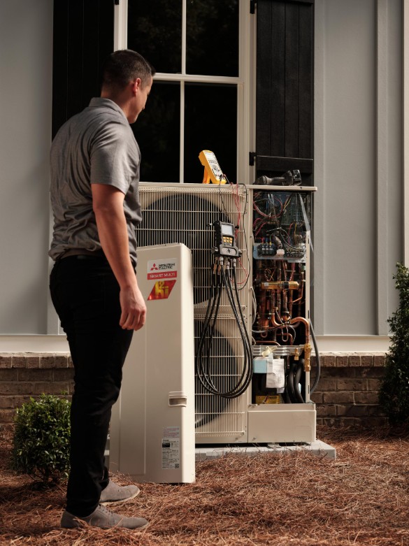 technician working on a Mitsubishi Electric AC unit in Monmouth County New Jersey